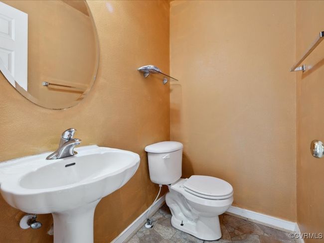 Bathroom with baseboards and toilet | Image 11