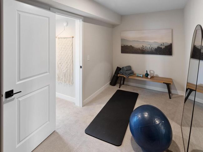The lower level flex room provides endless possibilities, whether you’re looking for a home gym, office, or hobby space, offering flexibility to suit your lifestyle. | Image 44