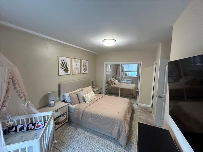 Bedroom with a closet | Image 4