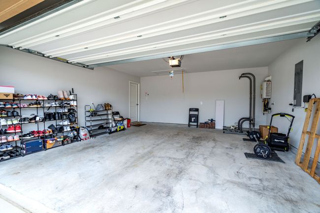 Garage with electric panel and a garage door opener | Image 23