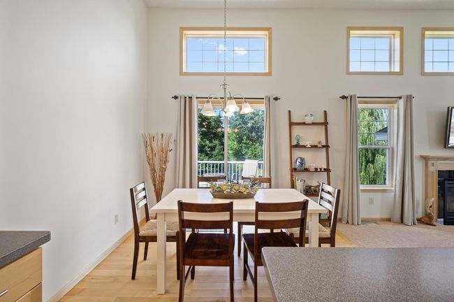 Dining area walks out to the deck. | Image 9