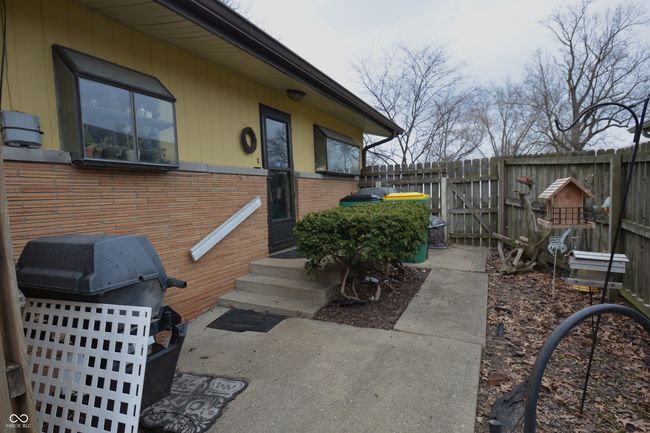 view of patio featuring fence and area for grilling | Image 16