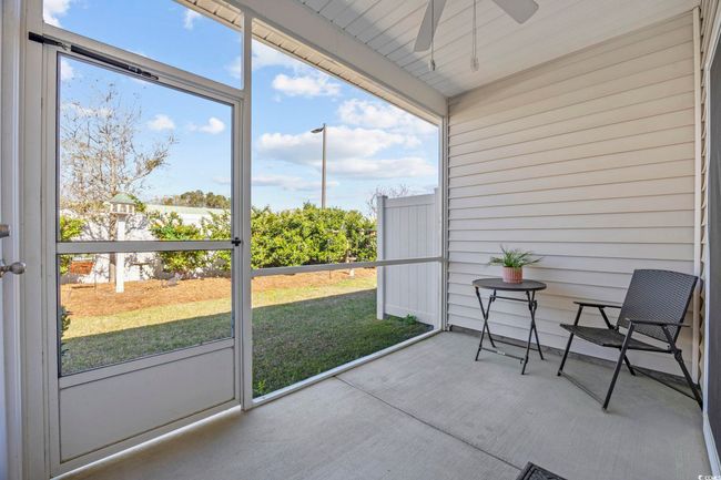 Unfurnished sunroom featuring a wealth of natural light and a ceiling fan | Image 26