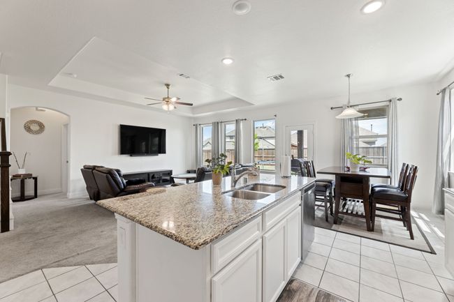 Kitchen with a wealth of natural light, large island | Image 18