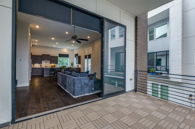 Second level - located off the living room, this is your largest patio of the two overlooking the community pool. | Image 29