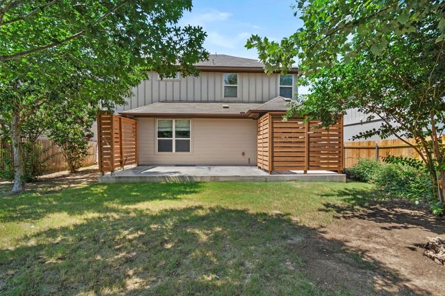 Rear view of property featuring board and batten siding and a patio | Image 34