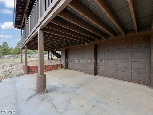 View of patio / terrace with a garage, a carport, and concrete driveway | Image 35