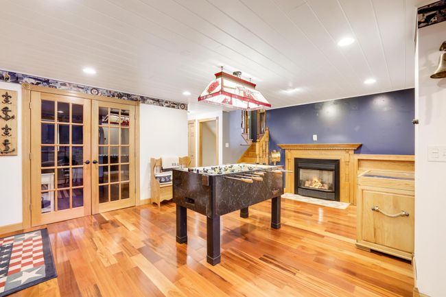 An entertainer's oasis! Gas fireplace, with custom cabinetry and lighting! | Image 27