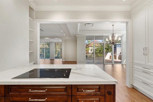 View of the living and dining room from the cooktop. | Image 14