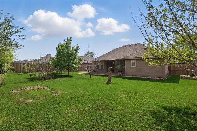 View of yard with a patio and a fenced backyard | Image 37