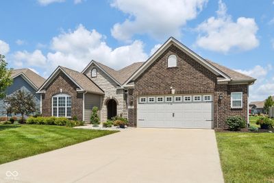 Front elevation boasts attractive brick and stone work. | Image 2