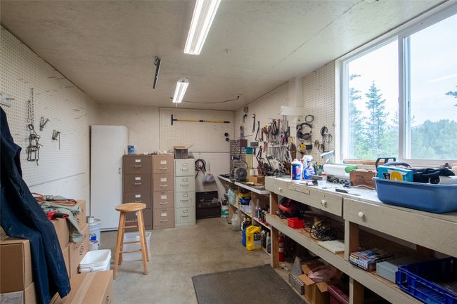Miscellaneous room with a workshop area and concrete floors | Image 16