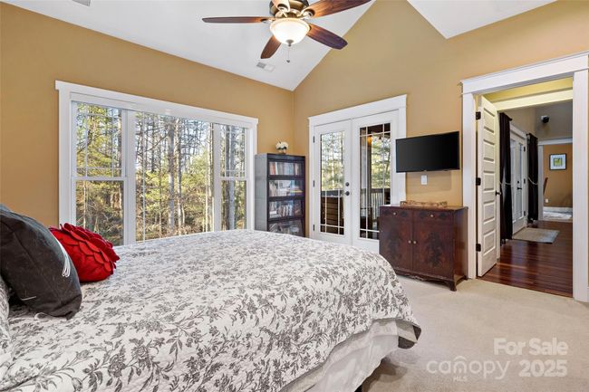 Primary bedroom leads to screened in porch | Image 23