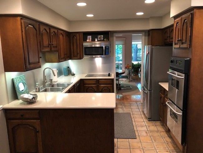 Kitchen with 'never' used stainless appliances | Image 12