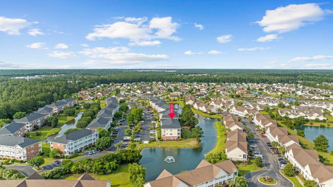 Aerial view of property's location with nearby suburban area and a large body of water | Image 29