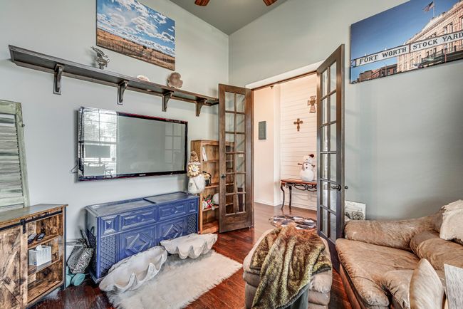 Office featuring ceiling fan, french doors, and dark wood-type flooring | Image 7