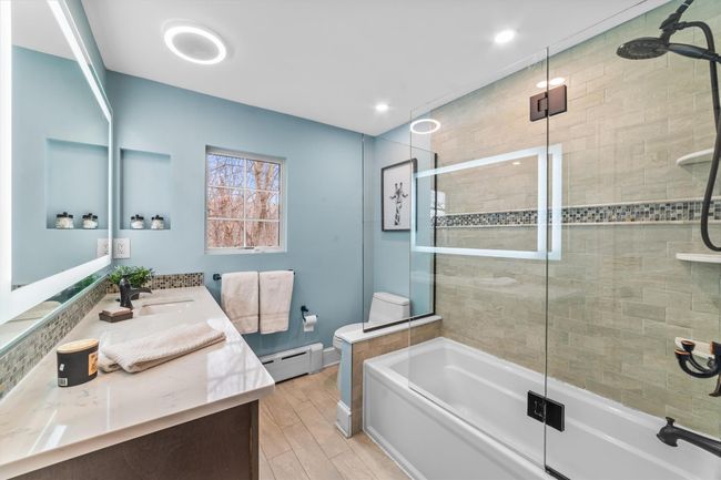 Full bathroom finished floors, double vanity and shower/tub | Image 27