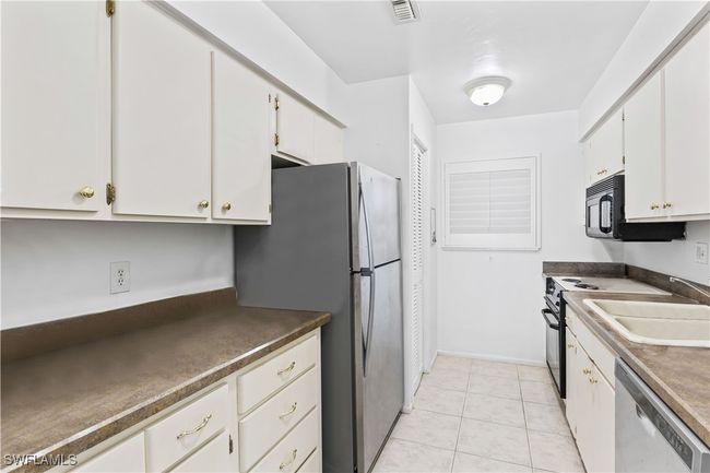 Practical and inviting, the kitchen space is ready to handle everything from quick meals to dinner parties. | Image 20