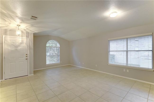 Spare room featuring light tile patterned flooring | Image 9