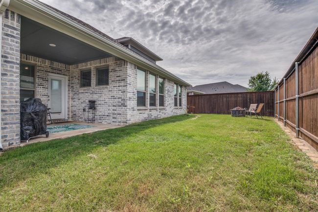 View of fenced backyard | Image 26