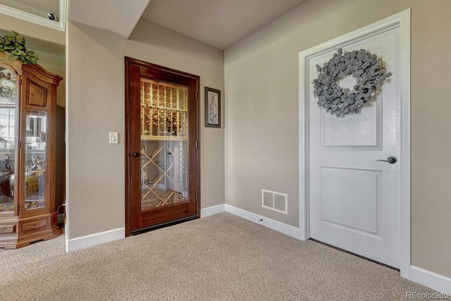 Wine 'cellar' closet. Not temperature controlled. To the right is a huge storage room with shelving and the mechanicals | Image 28