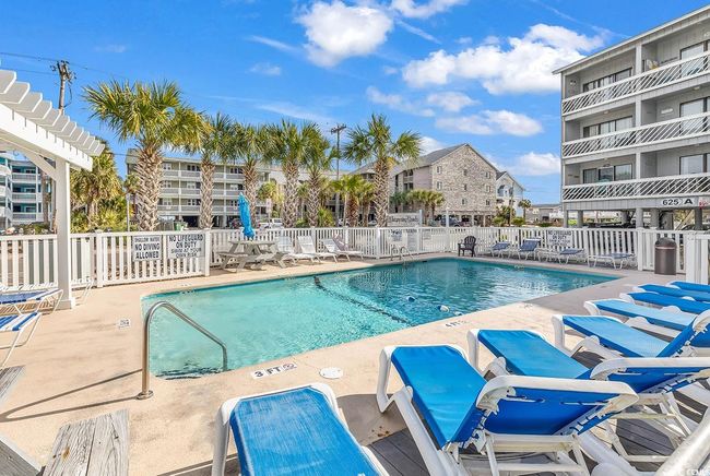 Pool with a patio and fence | Image 5