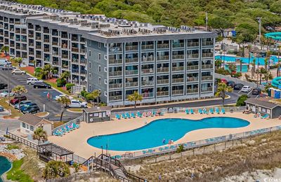 View of swimming pool featuring a patio area | Image 1