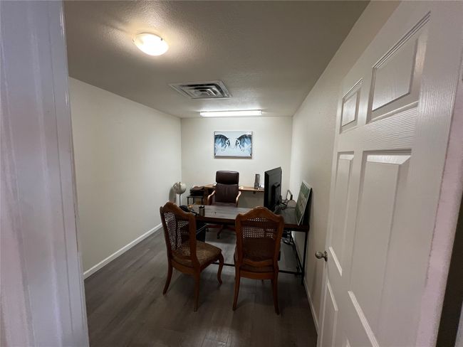 Office with wood finished floors, a textured ceiling, and baseboards | Image 27