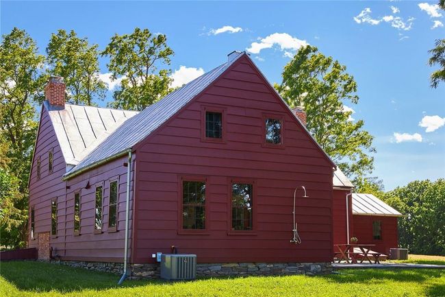 View of property exterior featuring cooling unit and a yard | Image 16