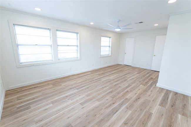 Spare room with visible vents, baseboards, ceiling fan, light wood-type flooring, and recessed lighting | Image 4