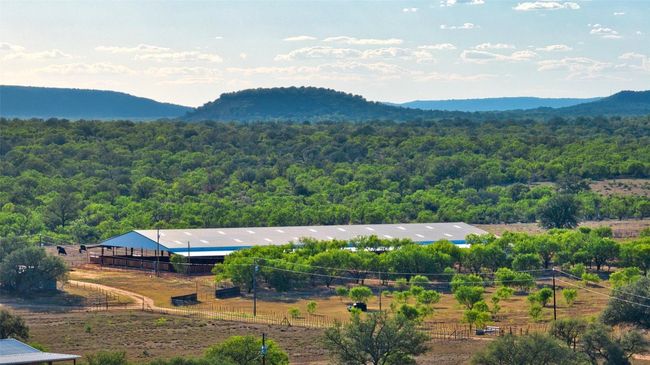 Approx. 140x275 multi use arena with 20x30 tackroom and 9 stalls on one side plus a cattle return lane, catch pen, roping chute with concrete lead up and *room to customize* on theother side. | Image 4