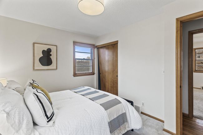 View of closet and east-facing window in the second bedroom | Image 20