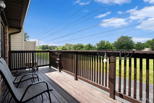 Wooden terrace featuring a lawn | Image 21