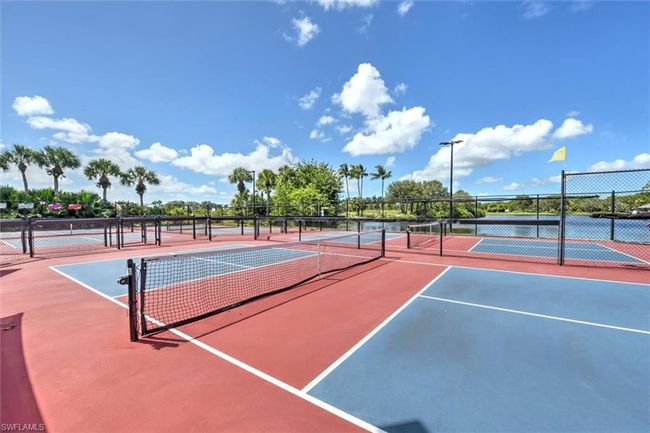 View of tennis court with fence | Image 41