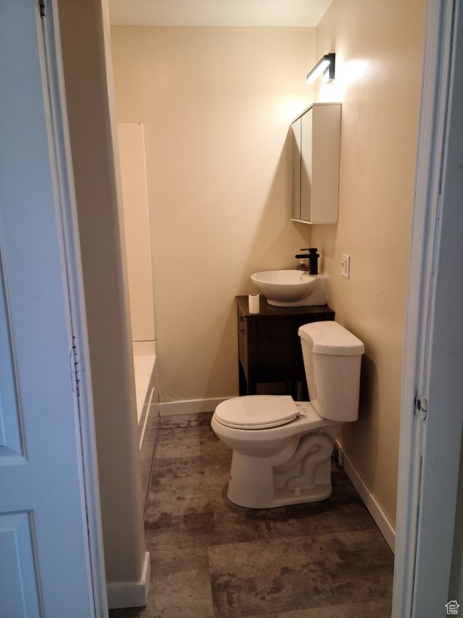 Full bathroom featuring vanity, toilet, and baseboards | Image 13