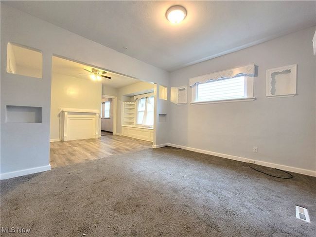 another view of living room and dining room. Flooring in carpet and vinyl | Image 4