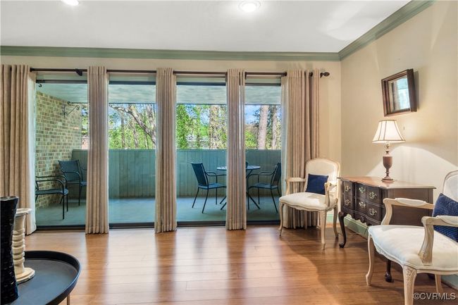 Doorway featuring crown molding and wood finished floors | Image 14