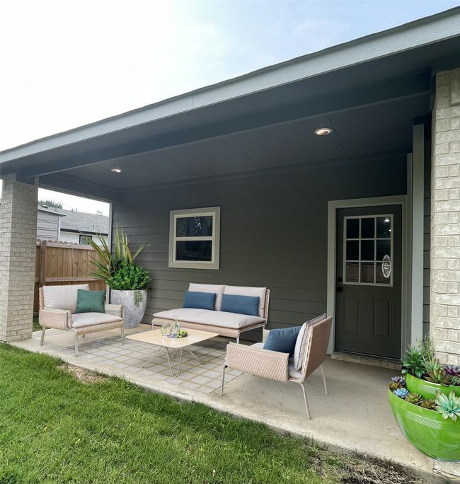 Virtually Staged/View of patio / terrace featuring outdoor lounge area and fence | Image 34