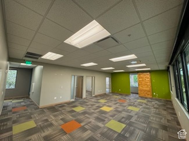 Carpeted spare room with a paneled ceiling | Image 18