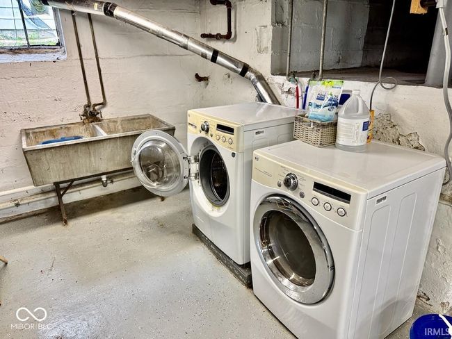 laundry room featuring washer and dryer | Image 32