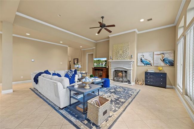 Large Family Room with actual wood burning fireplace to set the tone for cozy evenings. | Image 13