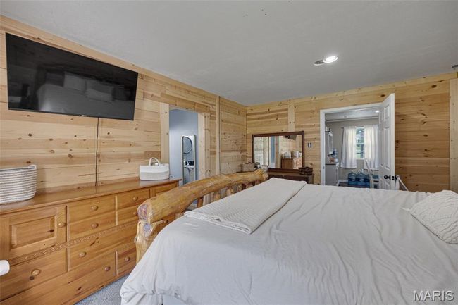 Bedroom with wooden walls and recessed lighting | Image 10