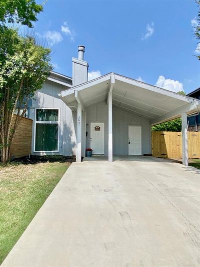 View of front of home with a front lawn and a carport | Image 2