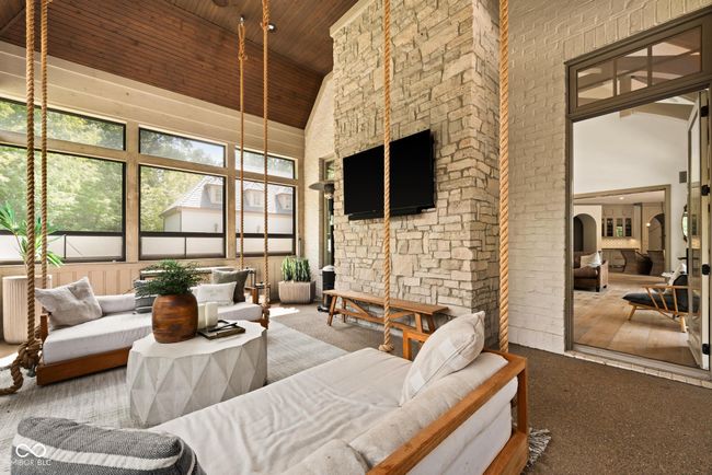 sunroom with vaulted ceiling and arched walkways | Image 45