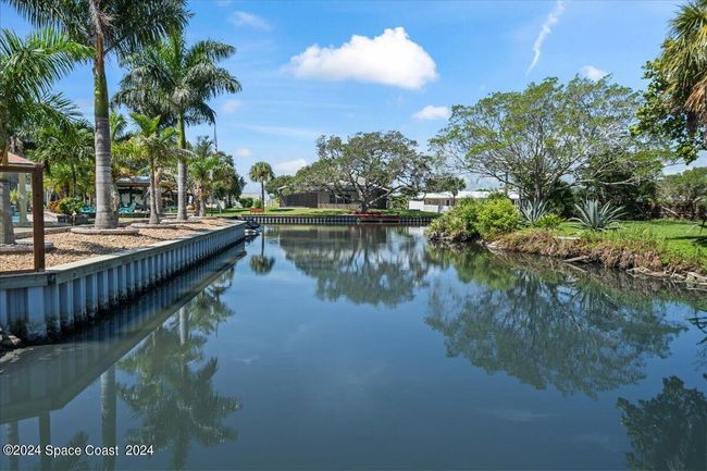 Private back yard looking down the canal which provides additional privacy and views | Image 57