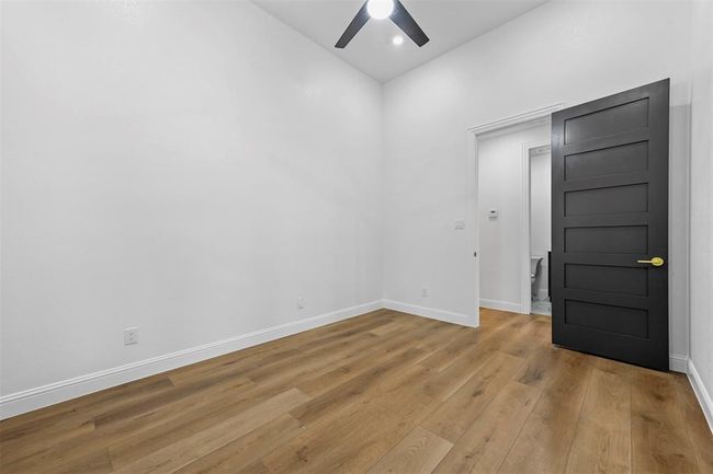 Empty room featuring hardwood / wood-style floors and ceiling fan | Image 31