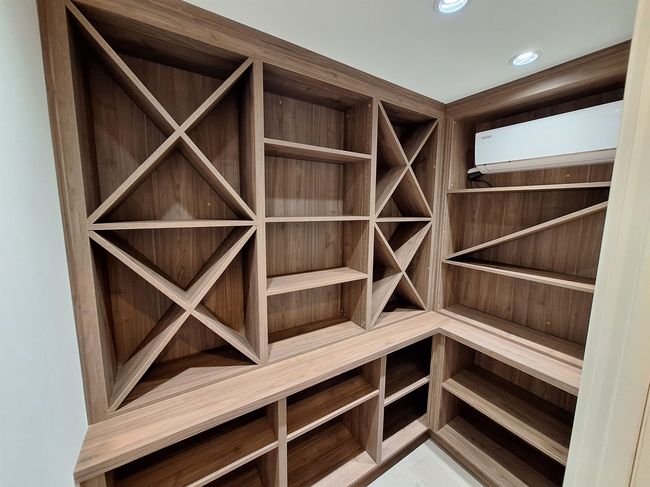 Wine cellar featuring a wall unit AC and recessed lighting | Image 33