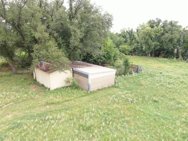 View of yard with an outdoor structure | Image 23