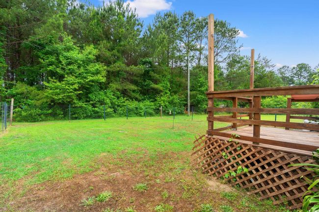 View of yard with a deck | Image 23