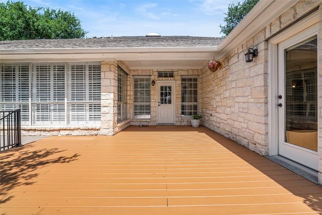 The expansive deck extends the living space outdoors, offering a perfect spot for entertaining or simply enjoying a quiet moment surrounded by nature | Image 30